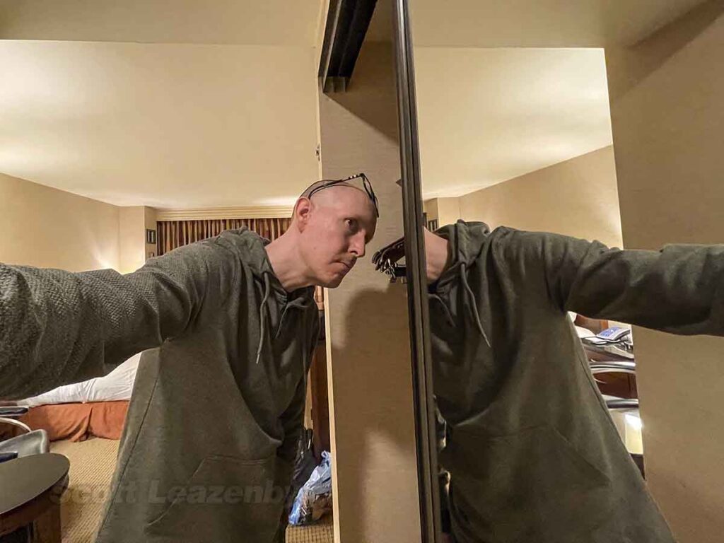 Scott Leazenby looking into the closet at the Chicago airport Hilton hotel