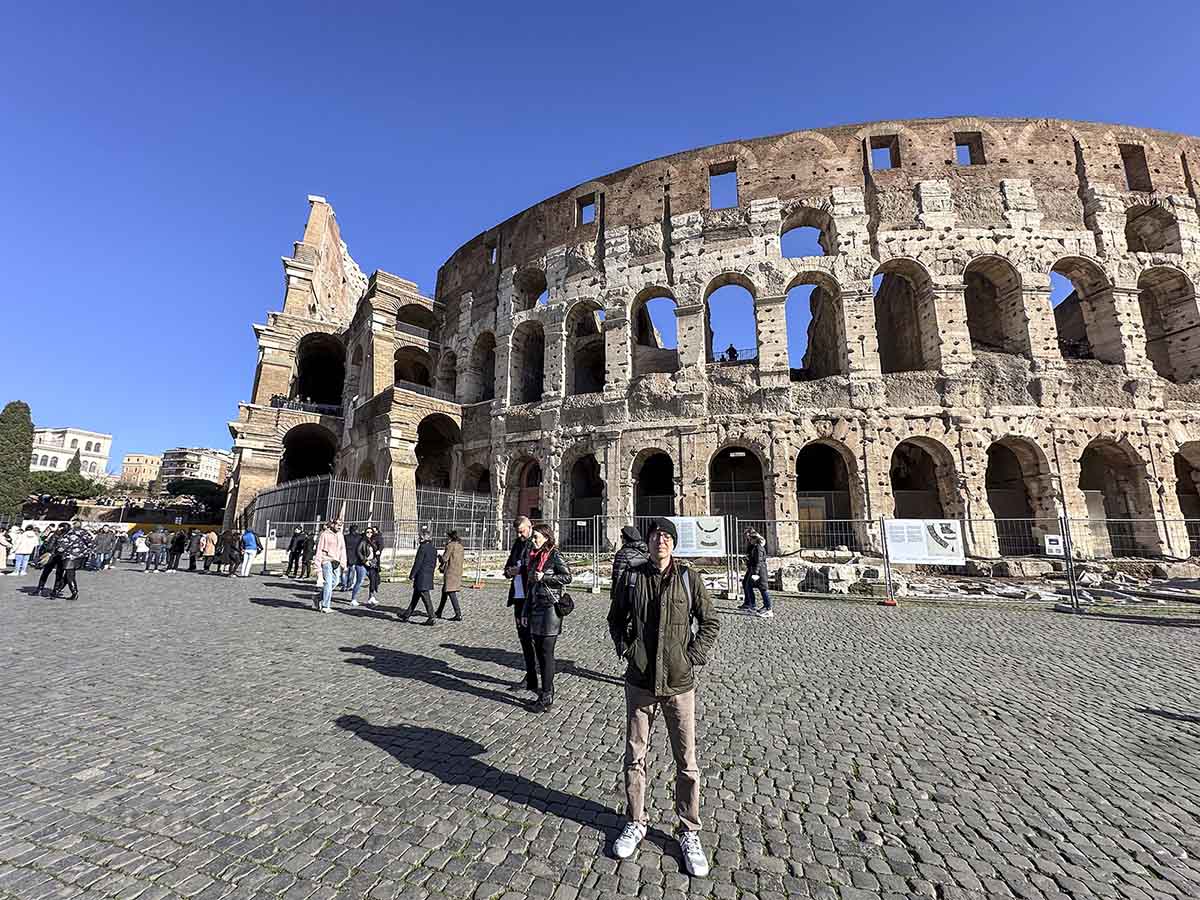 Scarred standing next to the Colosseum in Rome