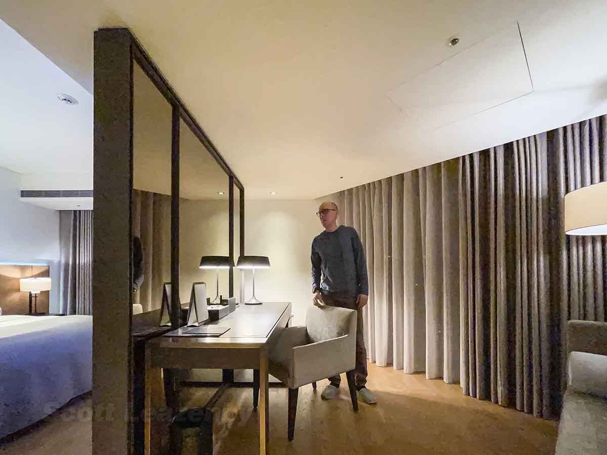 Scott walking around inside Madison Taipei Hotel suite 