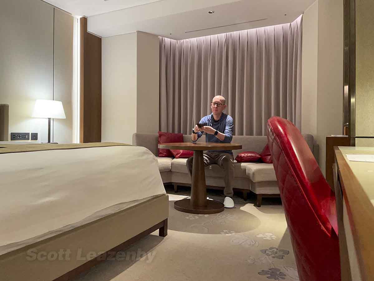 Scott reviewing his room at the Lotte Hotel Seoul