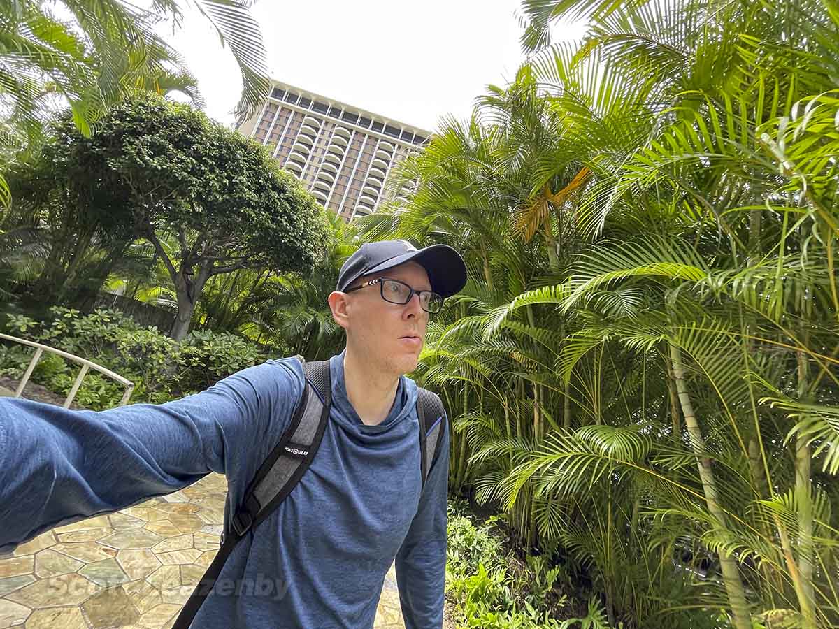 Scott Leazenby walking up to the entrance to the Hilton Hawaiian Village