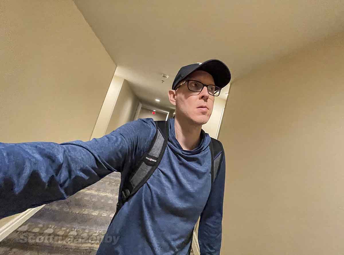 Scott Leazenby walking through guest room hallway at the Hilton Hawaiian Village Hotel