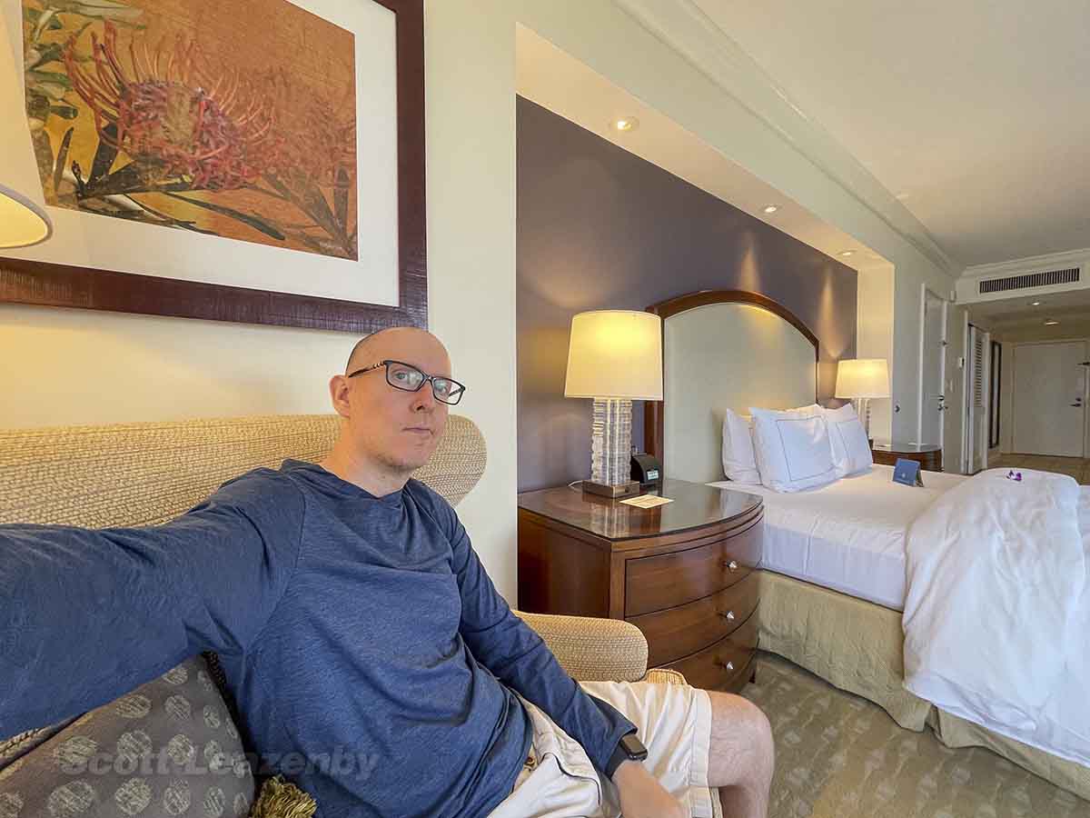 Scott sitting in a corner room at the Hilton Hawaiian Village Ali'i Tower