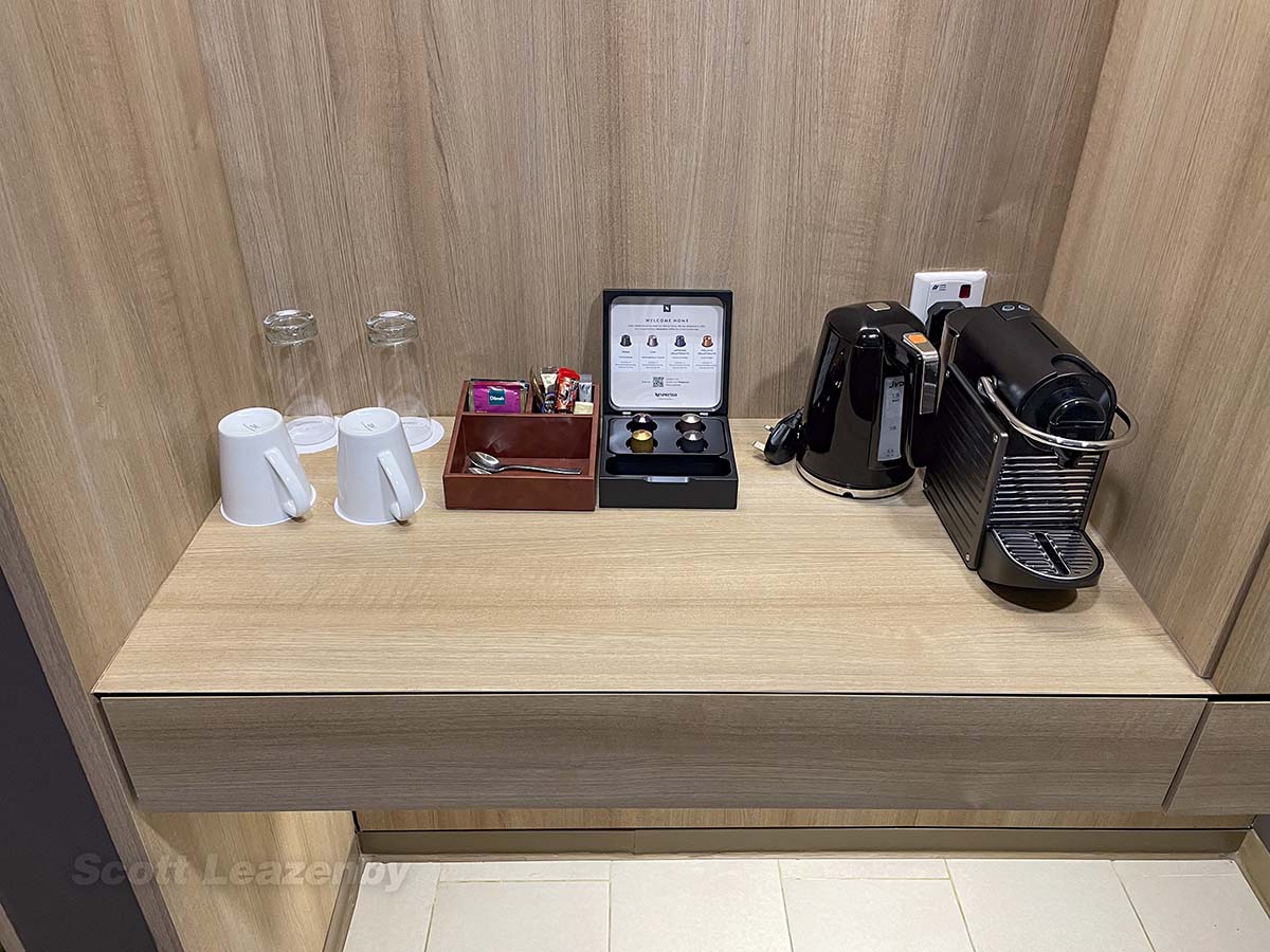 Coffee machine with tea and hot water dispenser