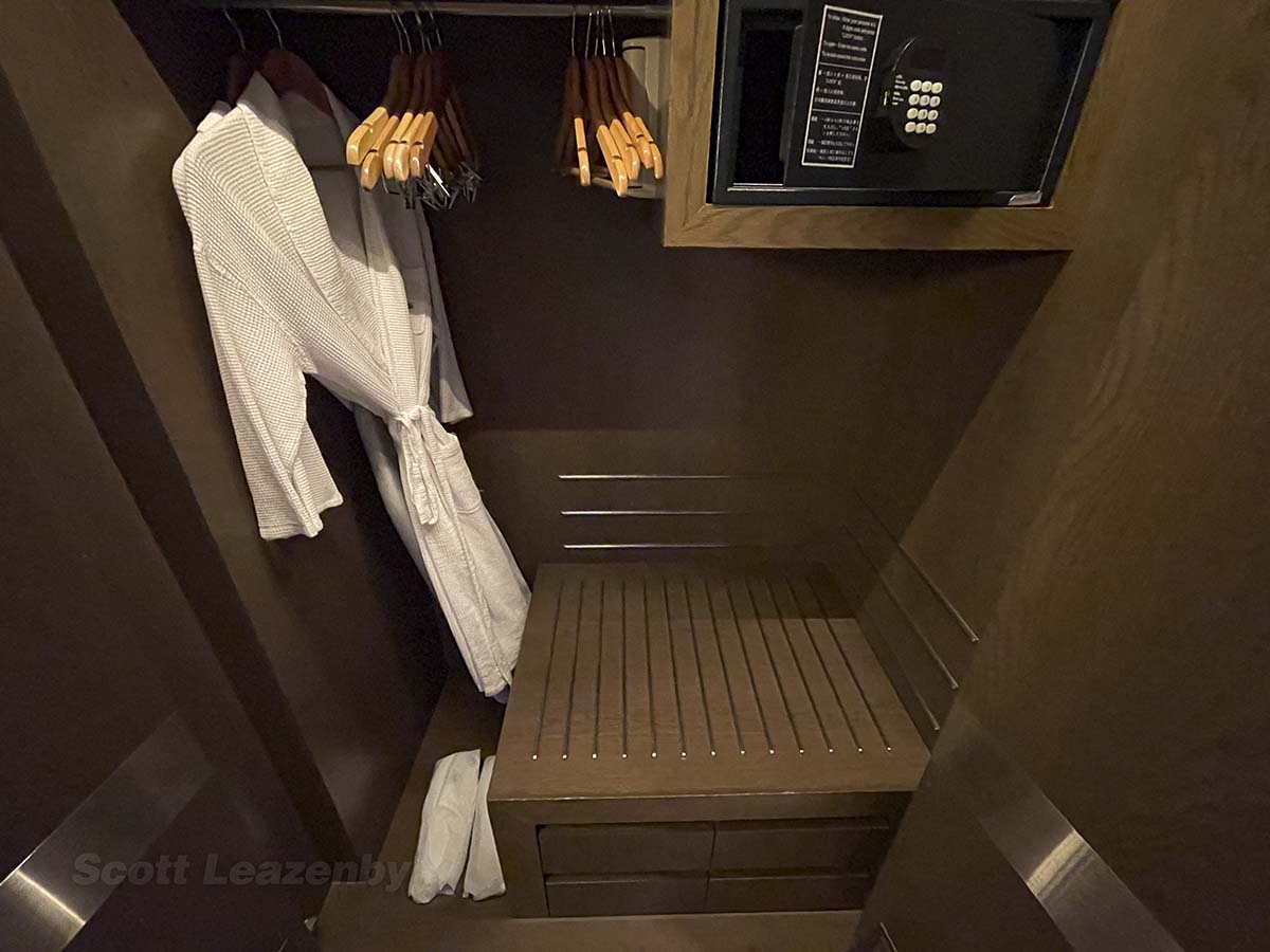 Closet space with safe and bathrobes