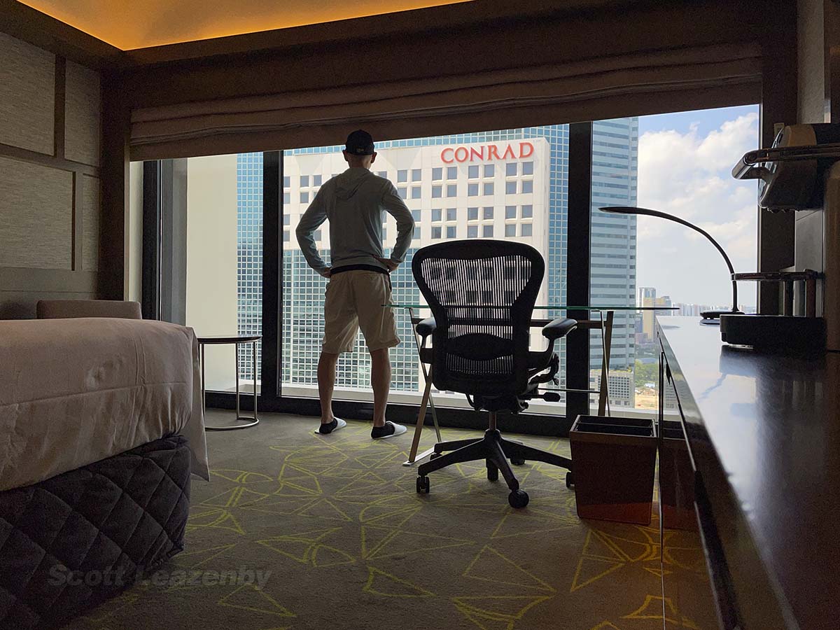 Scott enjoying the view from his room at the Pan Pacific Hotel in Singapore